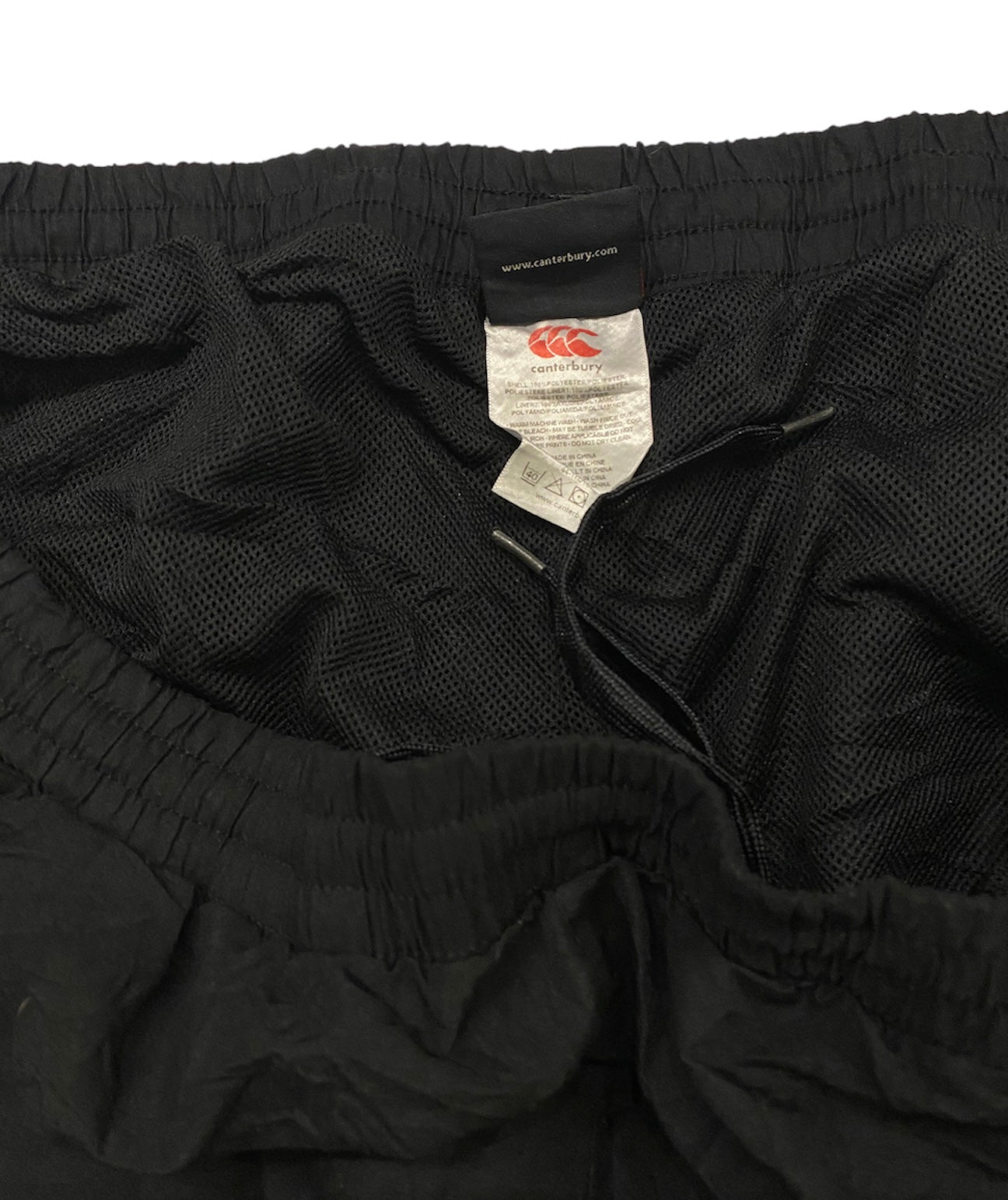 Canterbury tracksuit pants with ankle zippers
